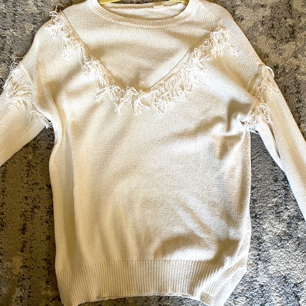 Cream sweater with fringe details